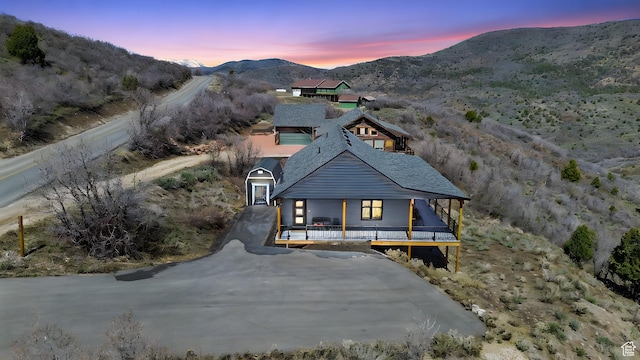1678 S Ridgeline Dr Unit 1276, Heber City, UT 84032 - exterior space featuring a porch, a chimney, roof with shingles, and a mountain view
