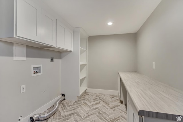 laundry area featuring washer hookup, hookup for an electric dryer, cabinet space, baseboards, and recessed lighting