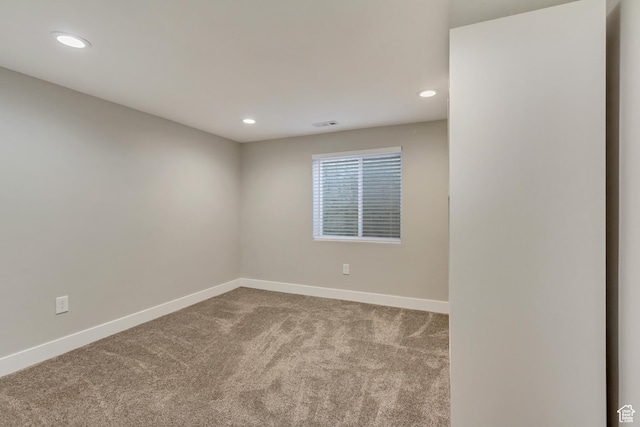spare room featuring visible vents, baseboards, carpet, and recessed lighting