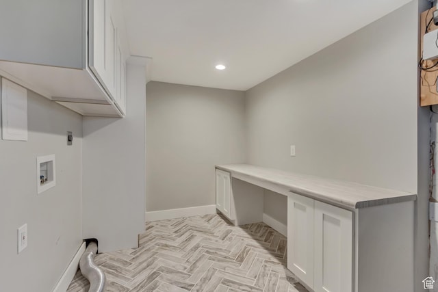 laundry area with baseboards, recessed lighting, washer hookup, and cabinet space