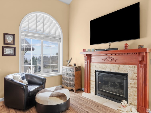 1004 Uri Ln, Midway, UT 84049 - sitting room with a fireplace with flush hearth, baseboards, and wood finished floors