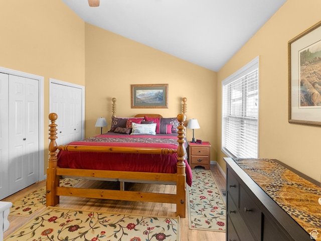 1004 Uri Ln, Midway, UT 84049 - bedroom with lofted ceiling, multiple closets, and light wood-type flooring