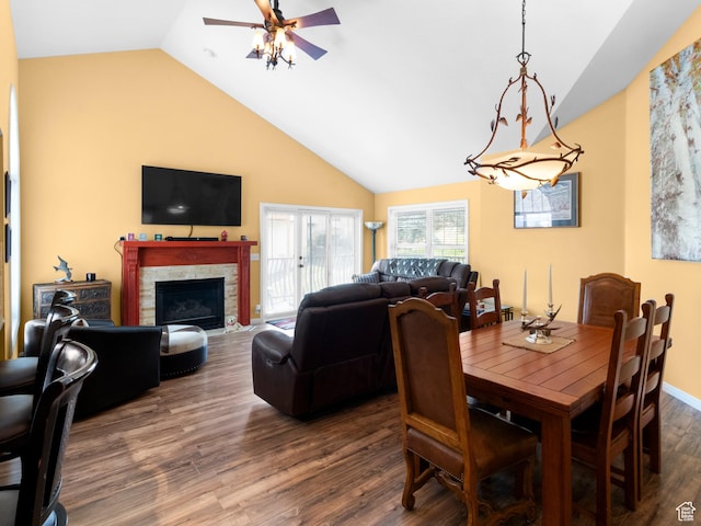 1004 Uri Ln, Midway, UT 84049 - dining space with a fireplace with flush hearth, ceiling fan, wood finished floors, and high vaulted ceiling