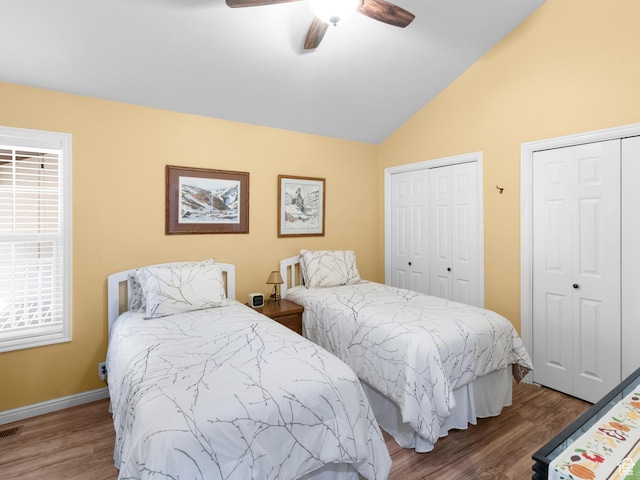 1004 Uri Ln, Midway, UT 84049 - bedroom featuring multiple closets, vaulted ceiling, wood finished floors, visible vents, and ceiling fan