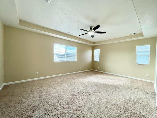 3859 W Young Lucerne Cir, Riverton, UT 84065 - carpeted empty room with a raised ceiling, a ceiling fan, and baseboards