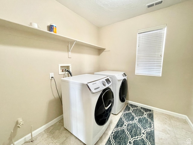 3859 W Young Lucerne Cir, Riverton, UT 84065 - laundry area with washing machine and clothes dryer, laundry area, visible vents, and baseboards