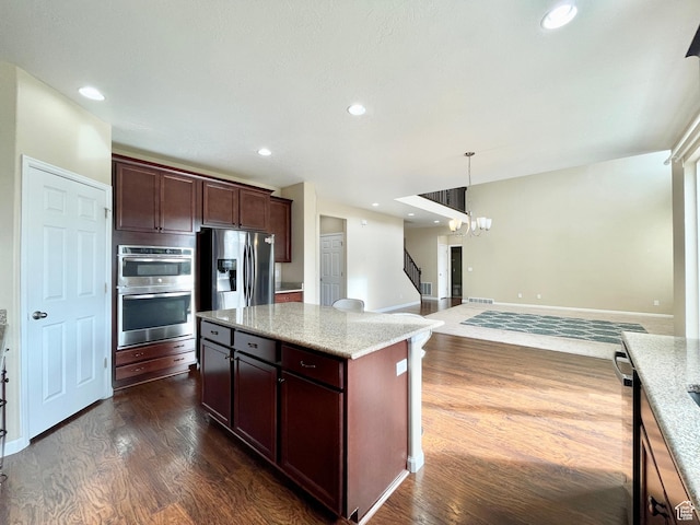 3859 W Young Lucerne Cir, Riverton, UT 84065 - kitchen featuring stainless steel appliances, light stone counters, dark wood-type flooring, a chandelier, and open floor plan