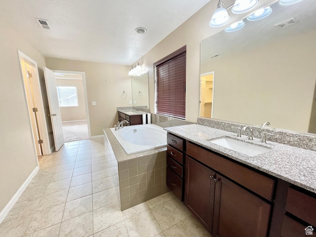 3859 W Young Lucerne Cir, Riverton, UT 84065 - bathroom featuring a bath, tile patterned floors, visible vents, and a sink
