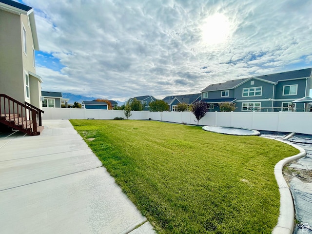 3859 W Young Lucerne Cir, Riverton, UT 84065 - view of yard with a fenced backyard, a pool, a residential view, and a patio