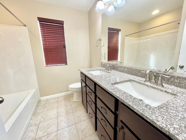 3859 W Young Lucerne Cir, Riverton, UT 84065 - bathroom featuring baseboards, toilet, a sink, and double vanity