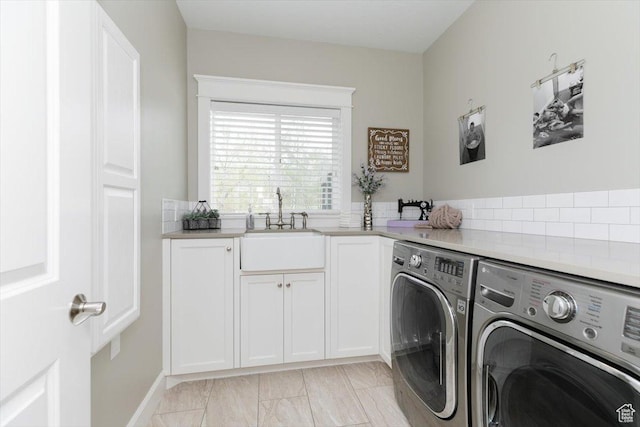 535 N Pheasant Hollow Ln, Mendon, UT 84325 - washroom featuring marble finish floor, a sink, baseboards, washer and dryer, and cabinet space