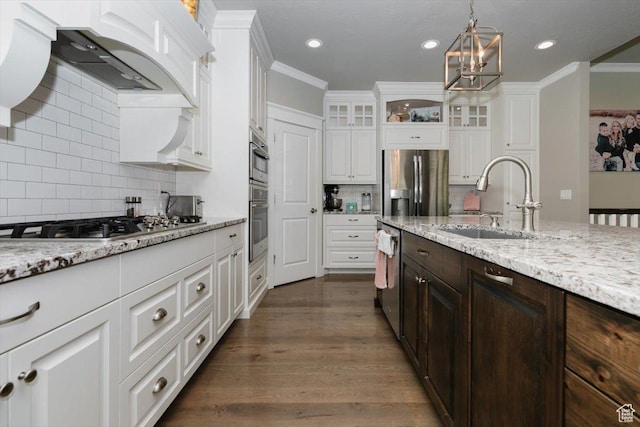 535 N Pheasant Hollow Ln, Mendon, UT 84325 - kitchen featuring custom exhaust hood, a sink, white cabinets, backsplash, and appliances with stainless steel finishes