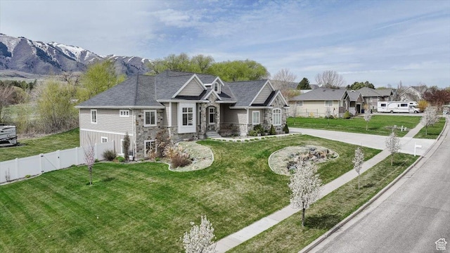535 N Pheasant Hollow Ln, Mendon, UT 84325 - view of front of home featuring a gate, stone siding, a front lawn, and fence
