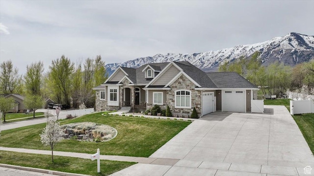535 N Pheasant Hollow Ln, Mendon, UT 84325 - craftsman inspired home with a garage, driveway, stone siding, a mountain view, and a front yard