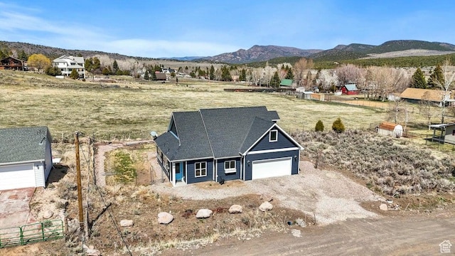 174 S 200 E, Pine Valley, UT 84781 - view of front facade featuring an attached garage, a mountain view, a rural view, and driveway