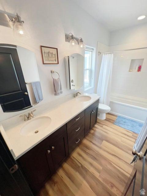 174 S 200 E, Pine Valley, UT 84781 - bathroom featuring toilet, wood finished floors, a sink, and double vanity