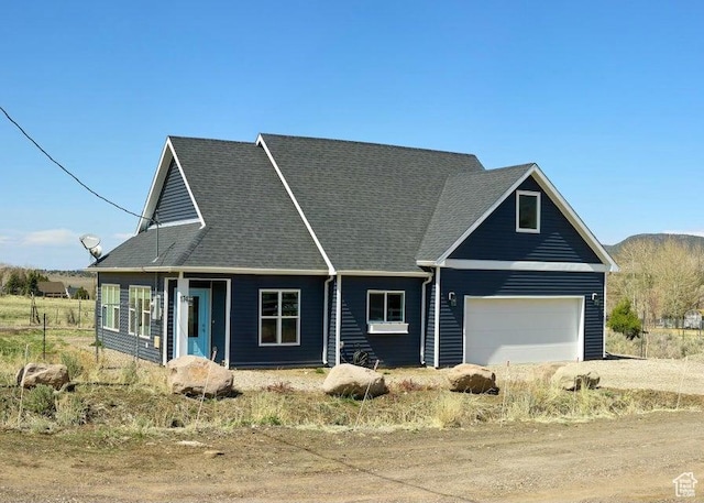 174 S 200 E, Pine Valley, UT 84781 - view of front of home featuring driveway, roof with shingles, and a garage
