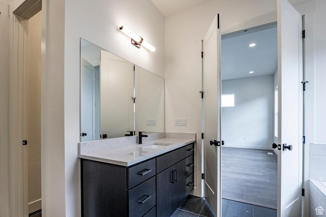 495 W Ascent Dr, Hideout, UT 84036 - bathroom featuring baseboards, vanity, and recessed lighting