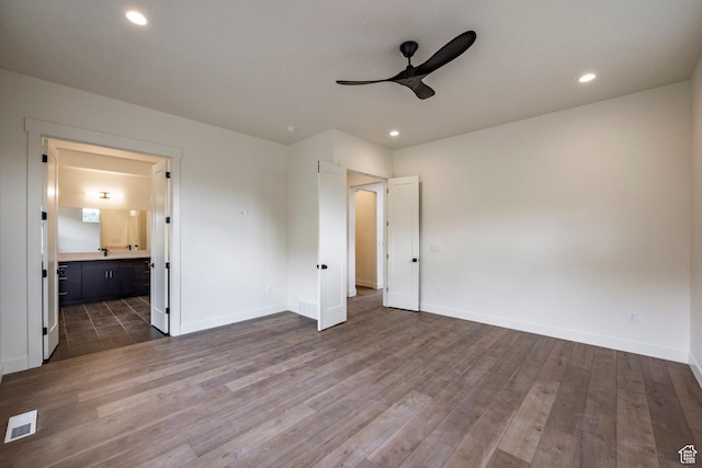495 W Ascent Dr, Hideout, UT 84036 - unfurnished bedroom featuring dark wood finished floors, visible vents, and baseboards