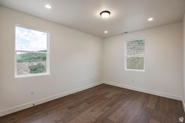 495 W Ascent Dr, Hideout, UT 84036 - empty room featuring baseboards, dark wood-type flooring, visible vents, and recessed lighting
