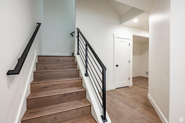 495 W Ascent Dr, Hideout, UT 84036 - stairs with baseboards, wood finished floors, visible vents, and recessed lighting