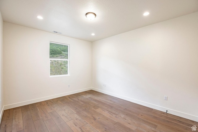 495 W Ascent Dr, Hideout, UT 84036 - unfurnished room with wood-type flooring, visible vents, baseboards, and recessed lighting