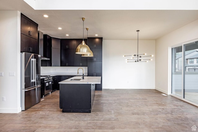 495 W Ascent Dr, Hideout, UT 84036 - kitchen with a sink, light wood finished floors, light countertops, baseboards, and appliances with stainless steel finishes