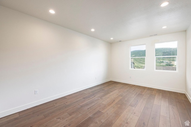 495 W Ascent Dr, Hideout, UT 84036 - empty room featuring recessed lighting, baseboards, visible vents, and hardwood / wood-style flooring