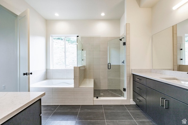 495 W Ascent Dr, Hideout, UT 84036 - bathroom with recessed lighting, a shower stall, tile patterned flooring, vanity, and a bath