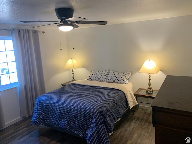bedroom with wood finished floors and ceiling fan