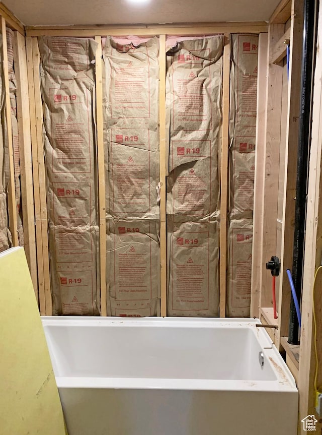 bathroom with a soaking tub