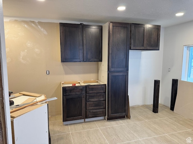 kitchen featuring recessed lighting, light countertops, and light tile patterned floors