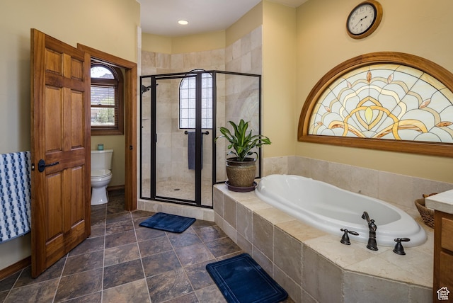 3270 E Rim Vistas Cir, Moab, UT 84532 - bathroom featuring baseboards, a garden tub, toilet, and a stall shower