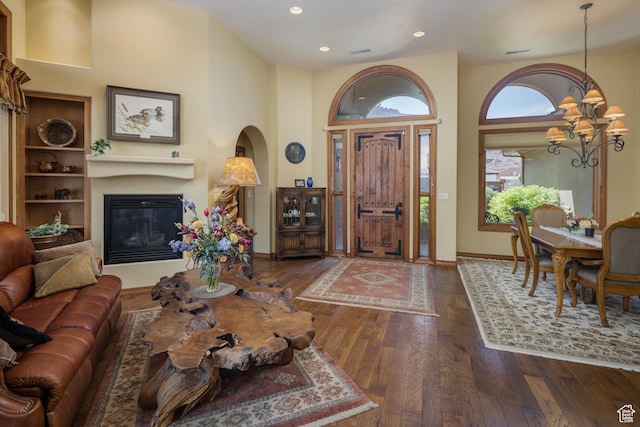 3270 E Rim Vistas Cir, Moab, UT 84532 - entrance foyer featuring hardwood / wood-style flooring, a glass covered fireplace, a chandelier, and recessed lighting