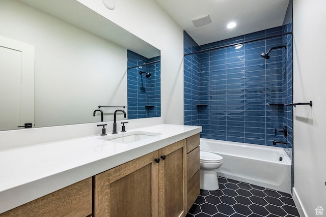 full bathroom with toilet, visible vents, shower / bath combination, tile patterned flooring, and vanity