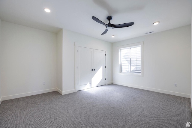 unfurnished bedroom featuring recessed lighting, visible vents, baseboards, carpet flooring, and ceiling fan