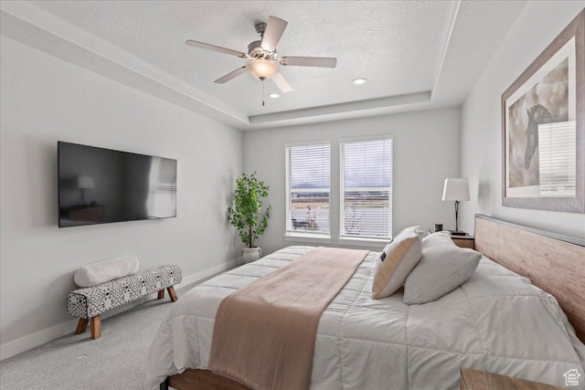 6079 W Teton Village Dr Unit 106, Herriman, UT 84096 - bedroom featuring a textured ceiling, baseboards, recessed lighting, a ceiling fan, and a raised ceiling