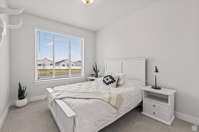6079 W Teton Village Dr Unit 106, Herriman, UT 84096 - bedroom featuring baseboards and carpet flooring