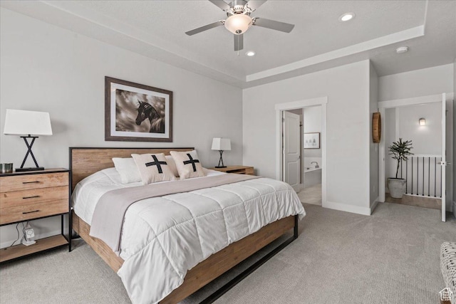 6079 W Teton Village Dr Unit 106, Herriman, UT 84096 - bedroom featuring ensuite bathroom, baseboards, recessed lighting, light colored carpet, and a raised ceiling