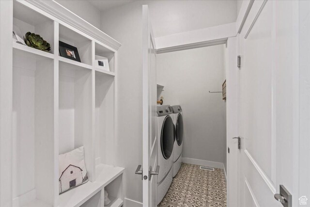 6079 W Teton Village Dr Unit 106, Herriman, UT 84096 - clothes washing area featuring light floors, washer and dryer, laundry area, baseboards, and visible vents