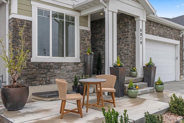6079 W Teton Village Dr Unit 106, Herriman, UT 84096 - view of patio / terrace with a garage