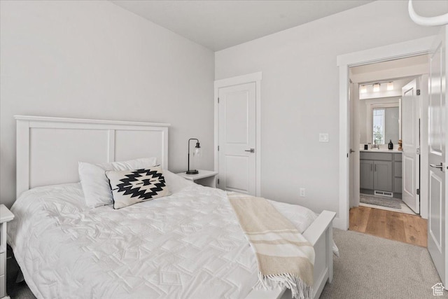6079 W Teton Village Dr Unit 106, Herriman, UT 84096 - carpeted bedroom with ensuite bath and visible vents