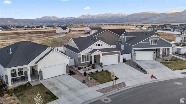 6079 W Teton Village Dr Unit 106, Herriman, UT 84096 - view of front facade featuring stone siding, driveway, fence, and a residential view