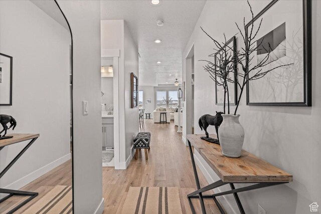 6079 W Teton Village Dr Unit 106, Herriman, UT 84096 - corridor featuring recessed lighting, light wood-style floors, and baseboards