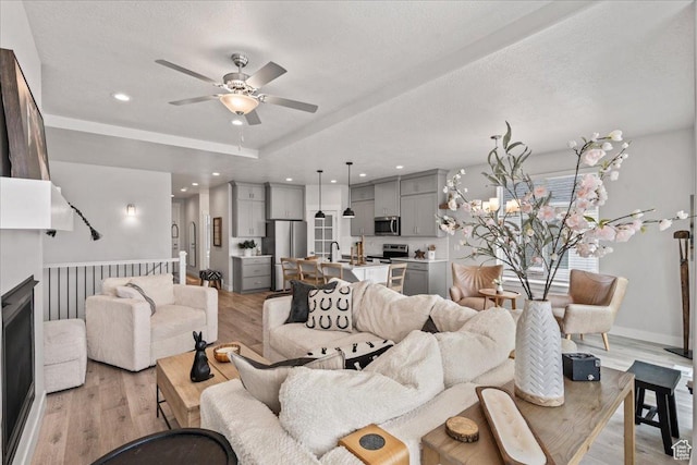 6079 W Teton Village Dr Unit 106, Herriman, UT 84096 - living area featuring a ceiling fan, recessed lighting, a textured ceiling, and light wood-style flooring