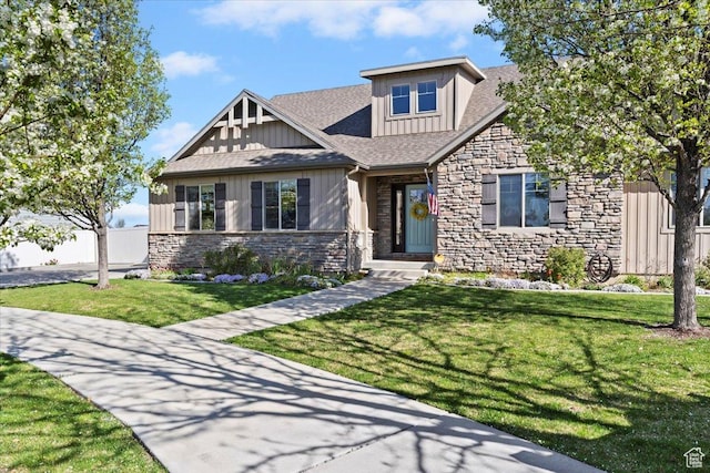 2292 W 440 S, Provo, UT 84601 - craftsman-style house featuring board and batten siding, stone siding, a front yard, and a shingled roof