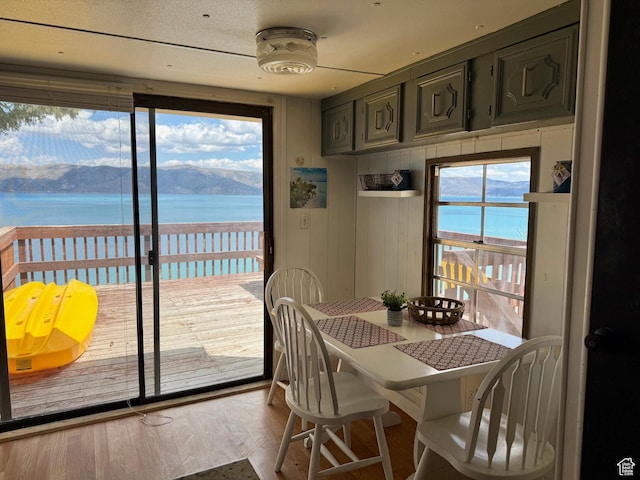 2904 S Edgemont Dr, Garden City, UT 84028 - dining area with a water view and wood finished floors