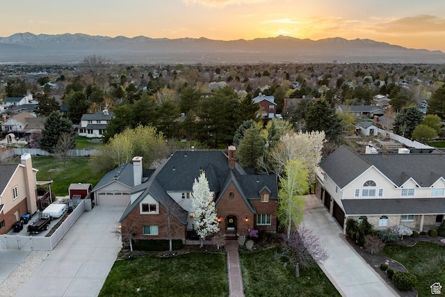 drone / aerial view featuring a mountain view and a residential view