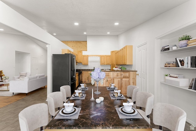 dining room with wood finished floors and recessed lighting