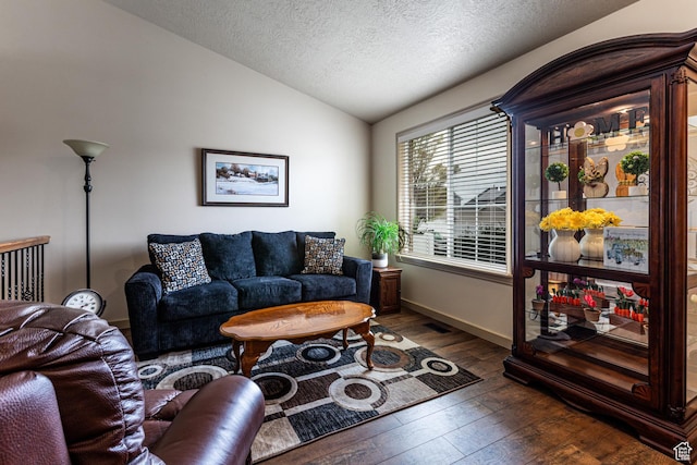 6576 W Oak Bridge Dr, West Jordan, UT 84081 - living area featuring lofted ceiling, wood-type flooring, a textured ceiling, and baseboards